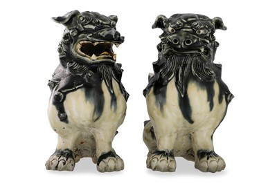 Lot 245 - A PAIR OF CHINESE GLAZED STONEWARE DOGS OF FO