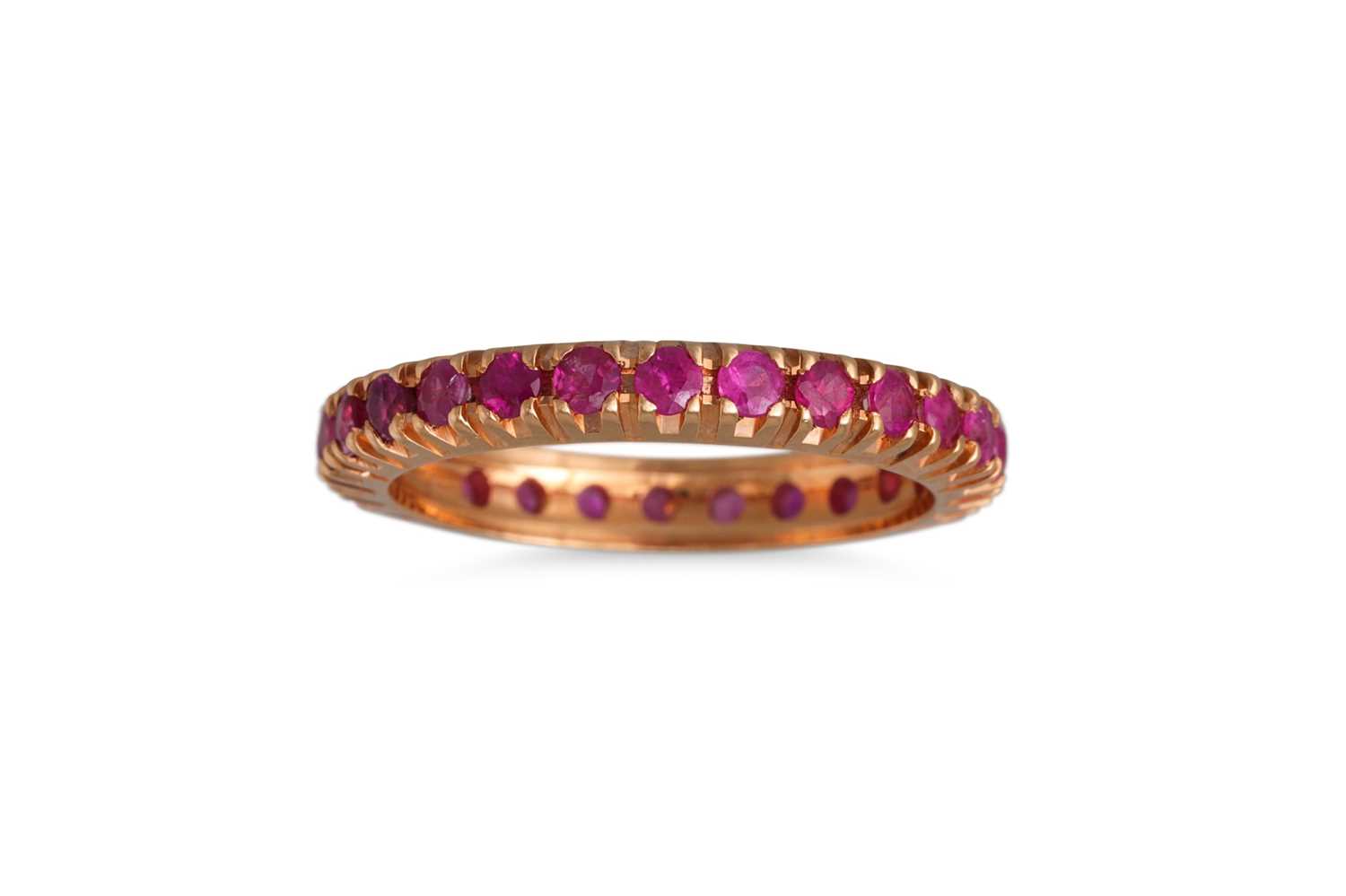 Lot 152 - A RUBY ETERNITY RING, in 18ct yellow gold....
