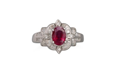 Lot 156 - A DIAMOND AND RUBY CLUSTER RING, the oval ruby...