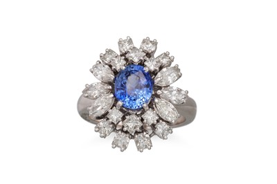 Lot 169 - A DIAMOND AND SAPPHIRE CLUSTER RING, the oval...