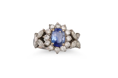 Lot 400 - A SAPPHIRE AND DIAMOND CLUSTER RING, the oval...