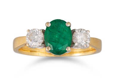 Lot 403 - AN EMERALD AND DIAMOND THREE STONE RING, the...