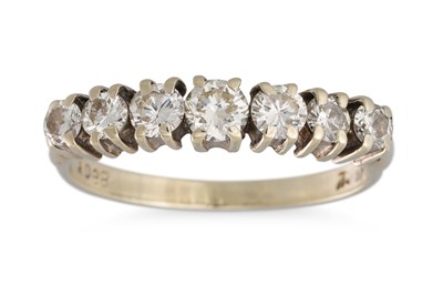 Lot 200 - A DIAMOND SEVEN STONE DRESS RING, the...