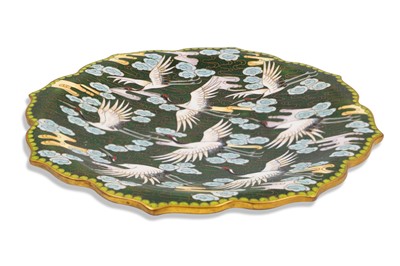 Lot 584 - A JAPANESE PLATE DEPICTING CRANES, on a green...