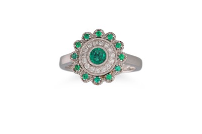 Lot 34 - A DIAMOND AND EMERALD CLUSTER RING, of...