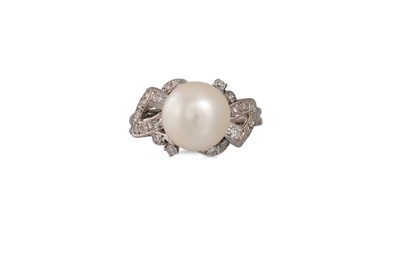 Lot 43 - A VINTAGE DIAMOND AND PEARL RING, the central...