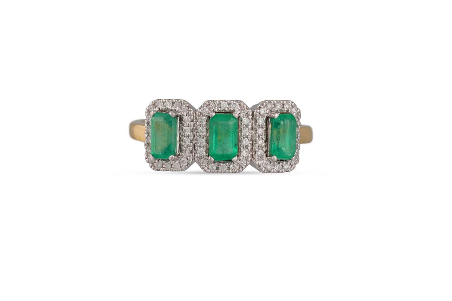 Lot 80 - AN EMERALD AND DIAMOND CLUSTER RING, the three...