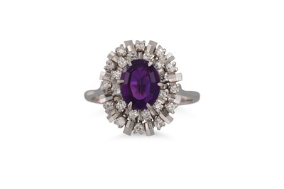 Lot 99 - A DIAMOND AND AMETHYST CLUSTER RING, the oval...