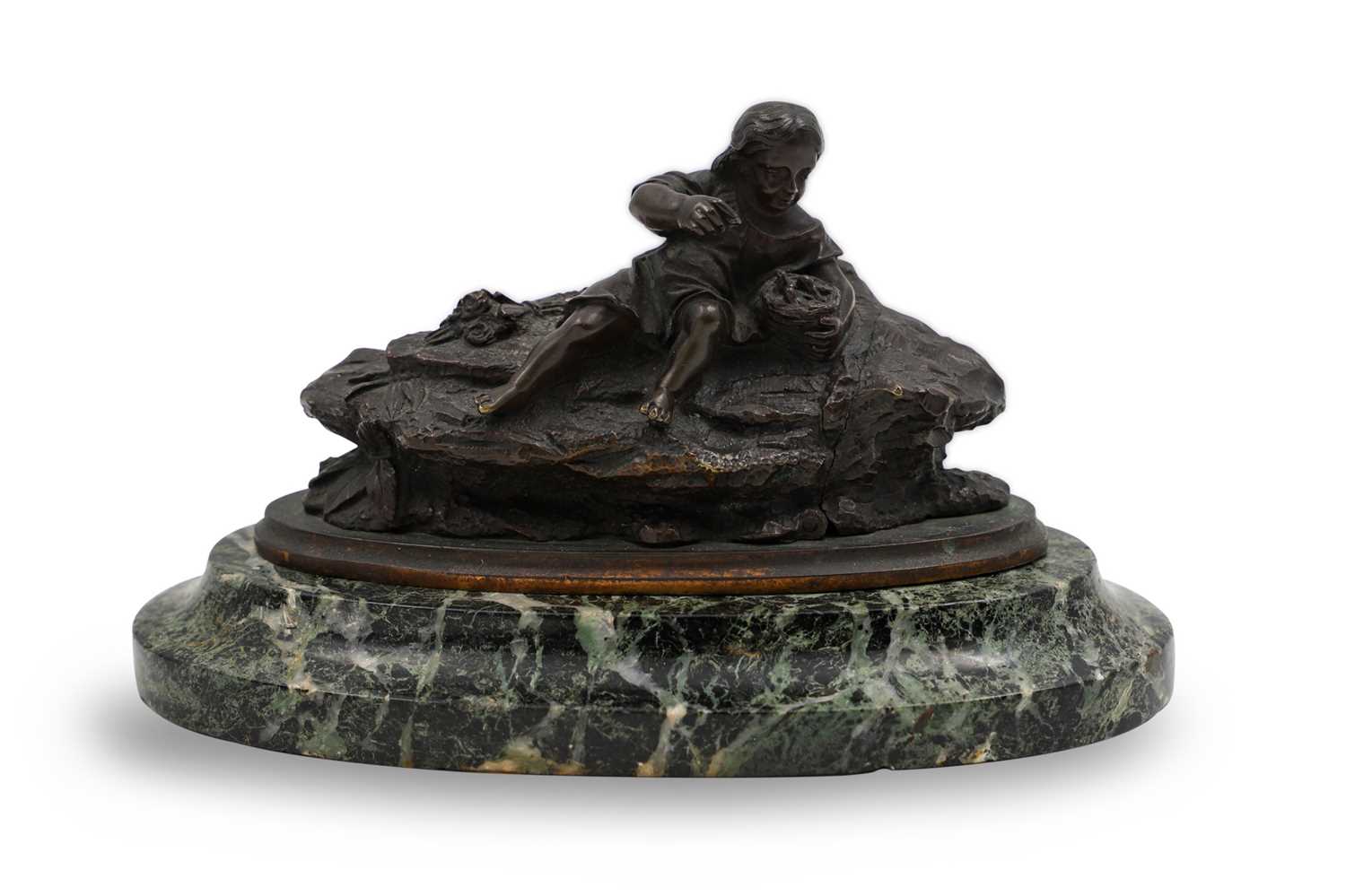 Lot 582 - A SMALL SCULPTURE OF A GIRL ON ROCKS, bronze...