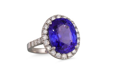 Lot 272 - A TANZANITE AND DIAMOND RING, the oval...