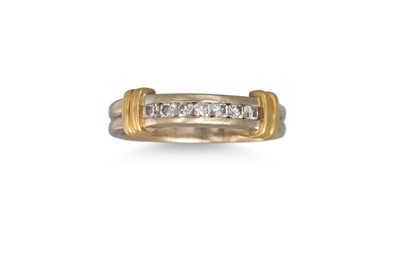 Lot 281 - A DIAMOND SEVEN STONE DRESS RING, in yellow...