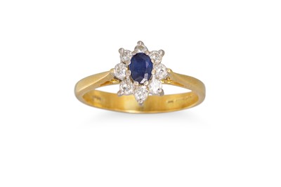 Lot 244 - A DIAMOND AND SAPPHIRE CLUSTER RING, mounted...