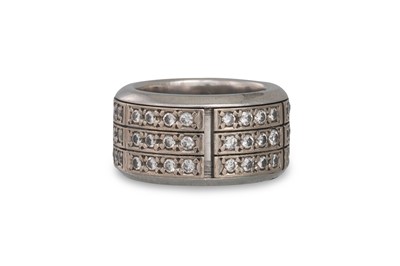 Lot 422 - A DIAMOND SET WIDE BAND, with central rotating...