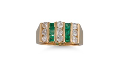 Lot 424 - AN EMERALD AND DIAMOND DRESS RING, set with...