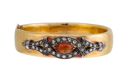 Lot 180 - AN ANTIQUE CITRINE AND DIAMOND BANGLE, the...
