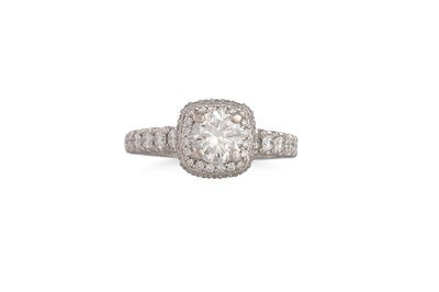 Lot 380 - A DIAMOND CLUSTER RING, the central brilliant...