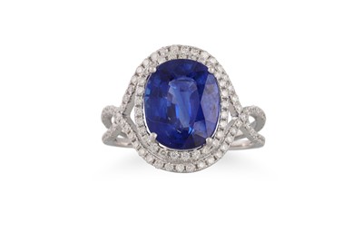 Lot 268 - A SAPPHIRE AND DIAMOND CLUSTER RING, the oval...