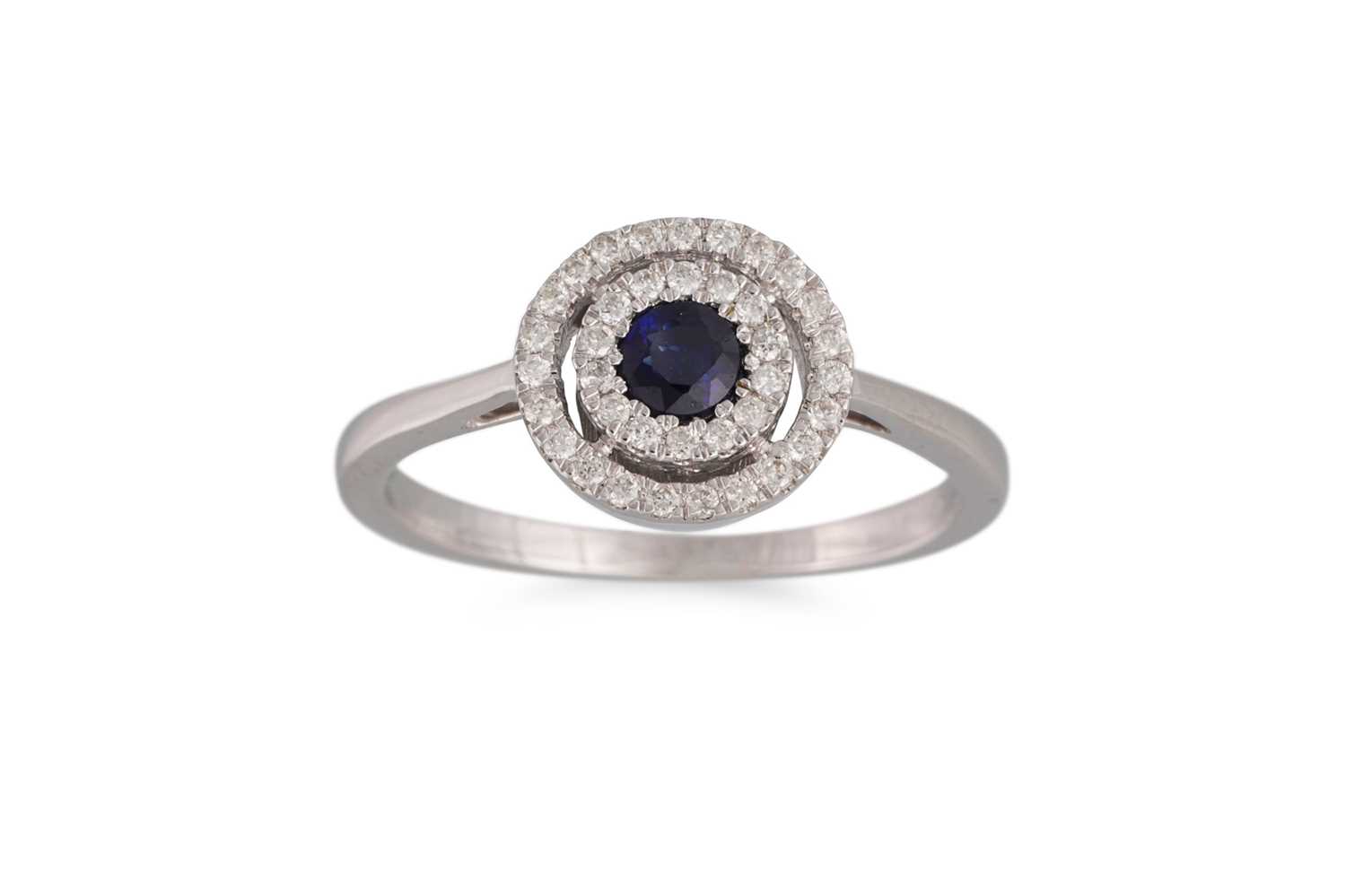 Lot 75 - A DIAMOND AND SAPPHIRE TARGET RING, mounted in...