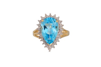Lot 96 - A DIAMOND AND BLUE TOPAZ RING, the pear shaped...