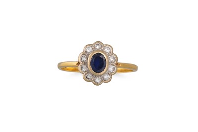 Lot 234 - A SAPPHIRE AND DIAMOND CLUSTER RING, of oval...