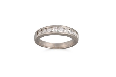 Lot 224 - A DIAMOND HALF ETERNITY RING, the channel set...