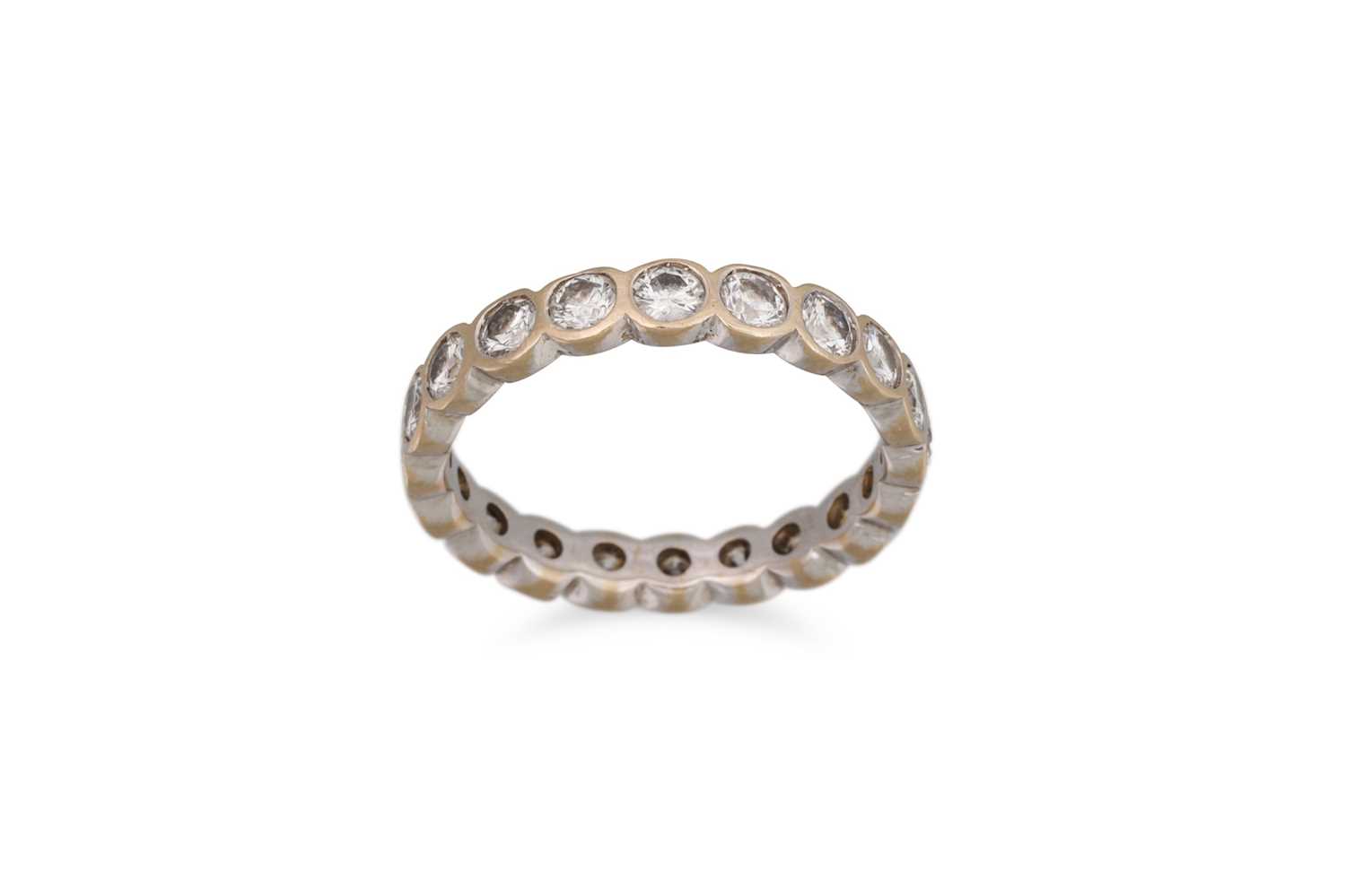 Lot 245 - A DIAMOND ETERNITY RING, the brilliant cut...