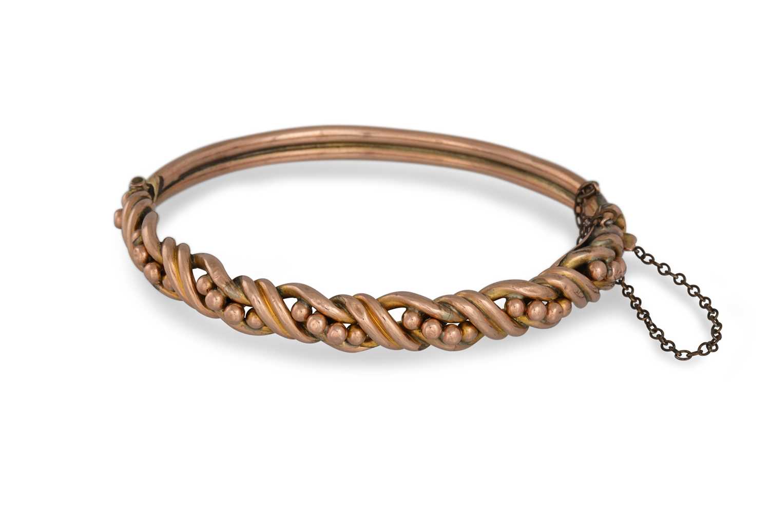 Lot 2 - AN ANTIQUE 9CT ROSE GOLD HINGED BANGLE,...