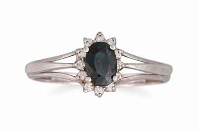 Lot 184 - A GREEN GEM STONE AND DIAMOND RING, set in...