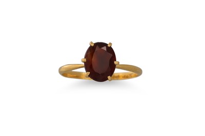 Lot 170 - A GARNET DRESS RING, mounted in 18ct yellow...