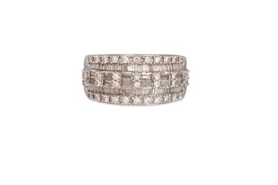 Lot 381 - A SIX ROWED DIAMOND RING, set with round...