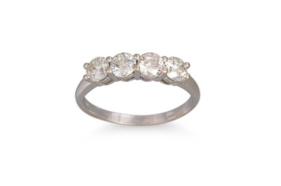 Lot 356 - A FOUR STONE DIAMOND RING, the round brilliant...