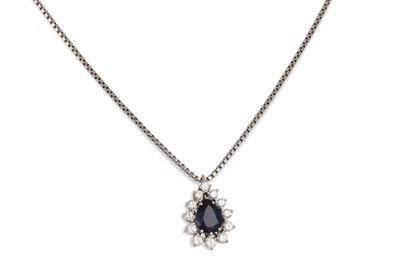 Lot 127 - A DIAMOND AND SAPPHIRE CLUSTER PENDANT, the...