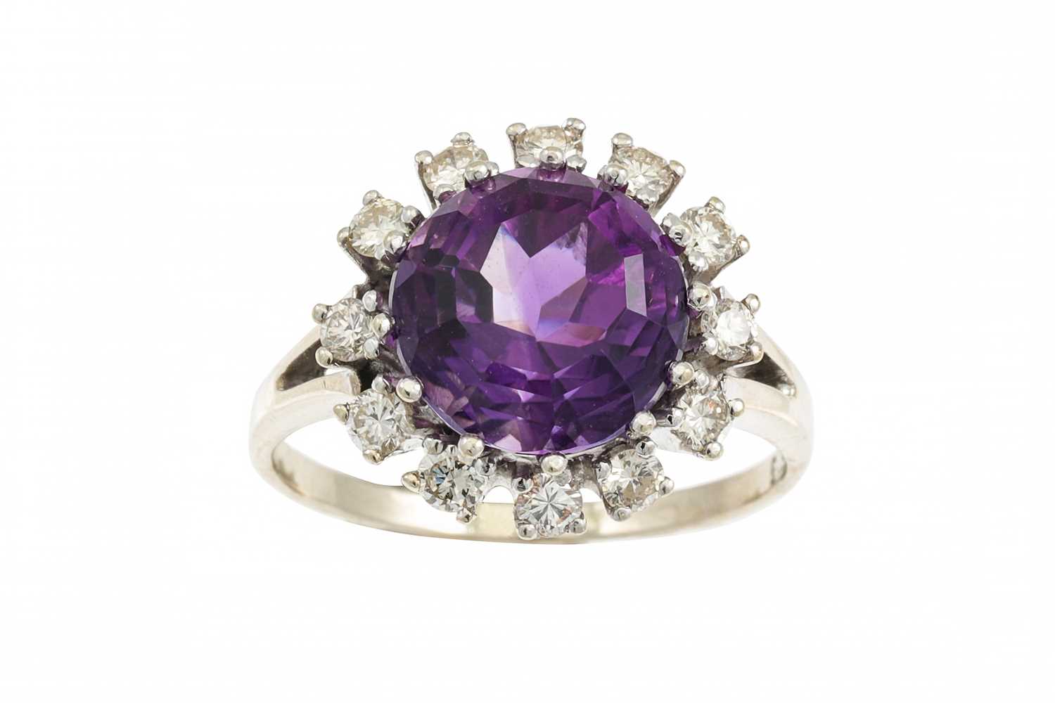 Lot 373 - AN AMETHYST AND DIAMOND CLUSTER RING, the...
