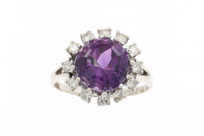 Lot 373 - AN AMETHYST AND DIAMOND CLUSTER RING, the...