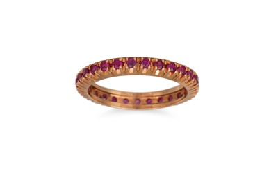 Lot 139 - A RUBY ETERNITY RING, mounted in 18ct rose...