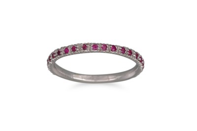 Lot 144 - A RUBY HALF ETERNITY RING, mounted in 18ct...