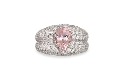 Lot 269 - A MORGANITE AND DIAMOND RING, the pear shaped...