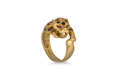Lot 141 - AN 18CT GOLD LEOPARD RING, set with sapphires,...