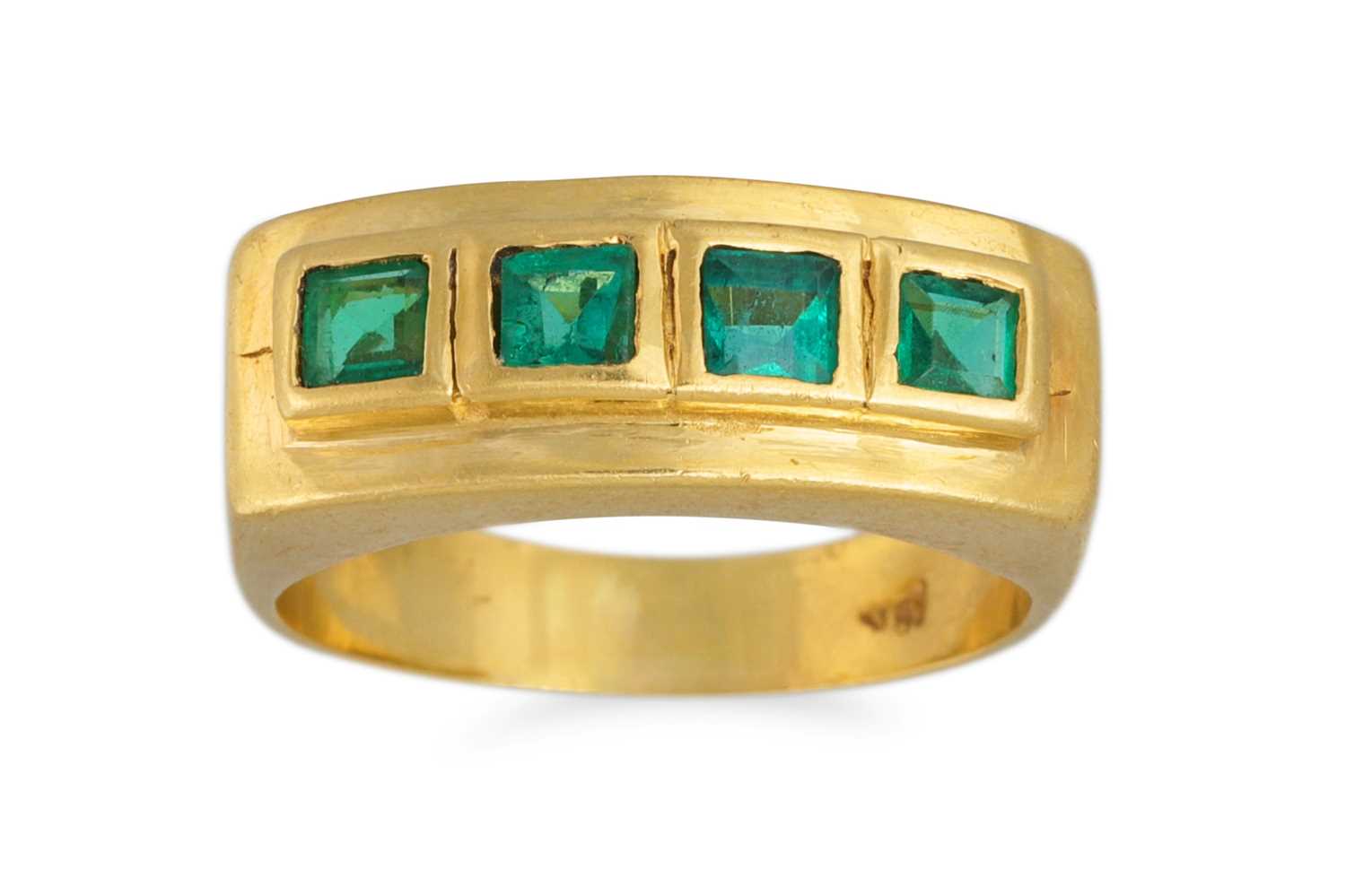 Lot 149 - AN EMERALD FOUR STONE RING, mounted in 18ct...