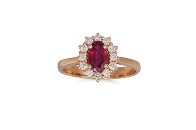 Lot 155 - A RUBY AND DIAMOND CLUSTER RING, the oval ruby...