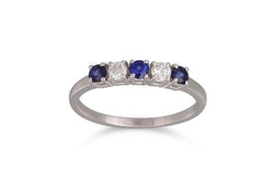 Lot 162 - A DIAMOND AND SAPPHIRE FIVE STONE RING, the...