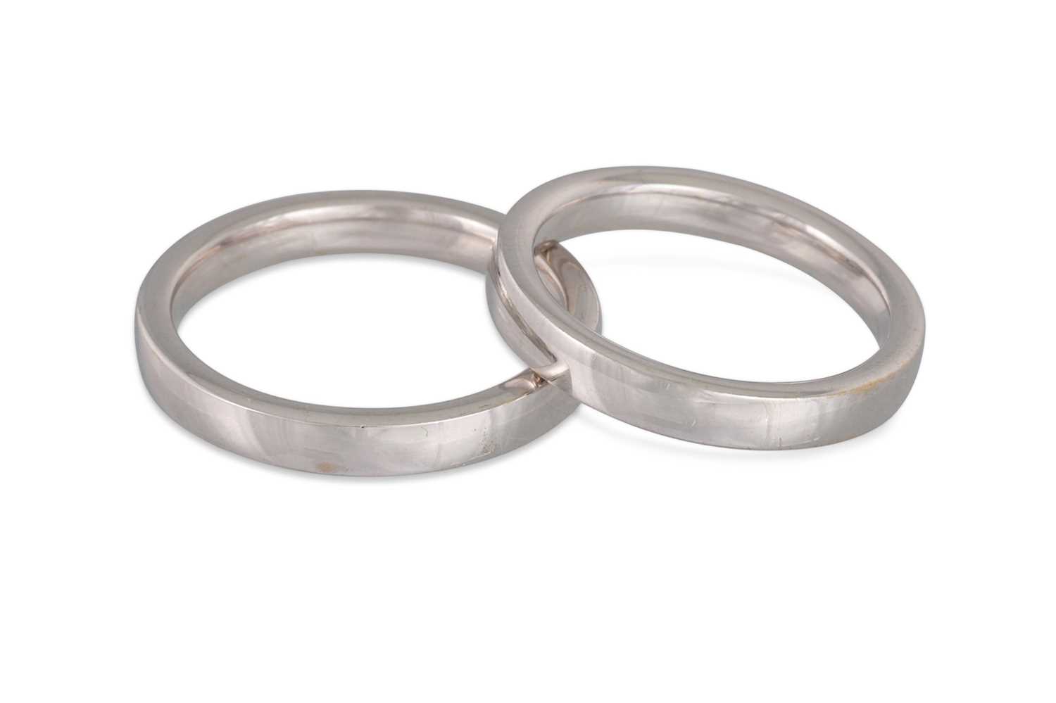 Lot 386 - A PAIR OF 18CT WHITE GOLD BANDS, Size: Q & T