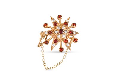 Lot 125 - A GARNET AND WHITE STONE SET STAR BROOCH,...