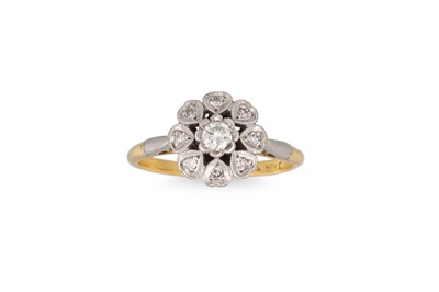 Lot 127 - A VINTAGE DIAMOND DAISY CLUSTER RING, mounted...