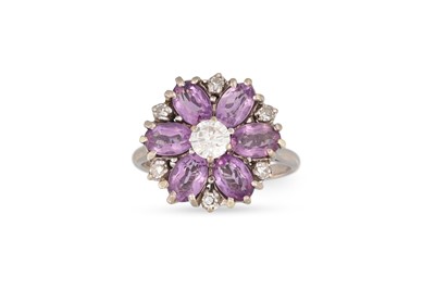 Lot 134 - AN AMETHYST AND DIAMOND FLORAL CLUSTER RING,...