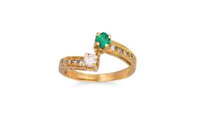 Lot 23 - AN EMERALD AND DIAMOND "TOI ET MOI" RING,...