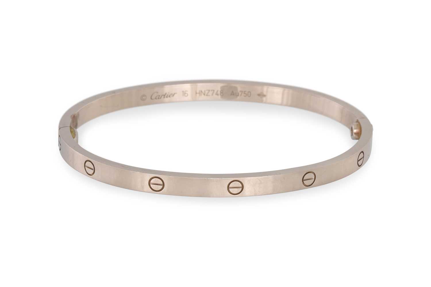 Lot 64 - A MODERN 18CT WHITE GOLD BANGLE, with...