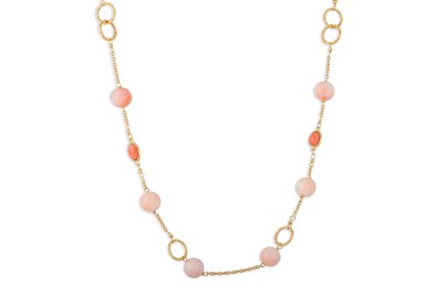 Lot 336 - A CORAL NECKLACE, the beads set between gold...