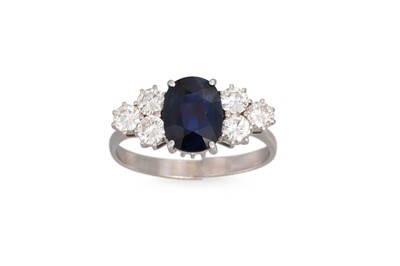 Lot 343 - A SAPPHIRE AND DIAMOND RING, the oval sapphire...