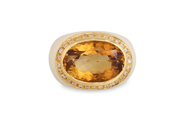 Lot 347 - A TOPAZ, DIAMOND AND ENAMEL RING, of domed...